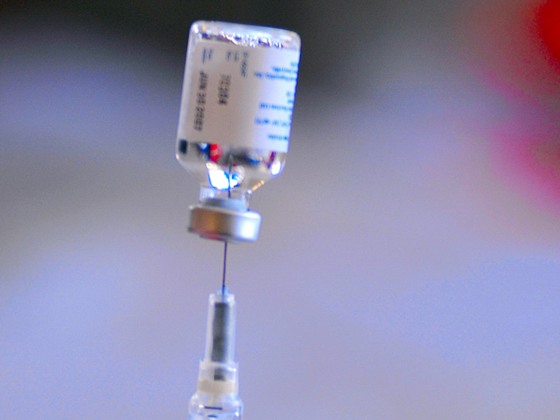 A nurse extracts a flu vaccine from a vial as San Luis Obispo County public healthcare professionals conduct a mass flu vaccination drill at the Veter...